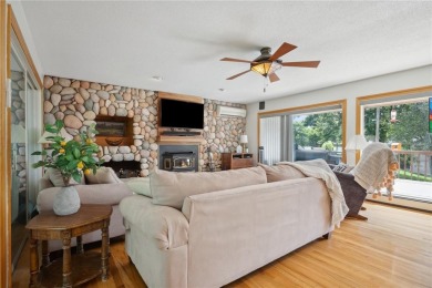 Cozy up to the crackle of the real wood fireplace in this home on Lake McBride Golf Course in Iowa - for sale on GolfHomes.com, golf home, golf lot