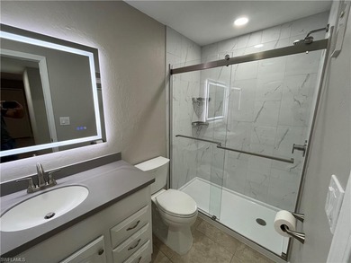 Beautifully Renovated FIRST FLOOR, CORNER UNIT with private on Fountain Lakes Community Golf Course in Florida - for sale on GolfHomes.com, golf home, golf lot