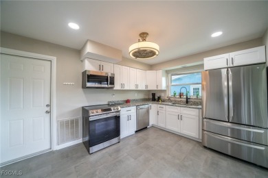 Affordable Pool Home in the Tarpon Point Marina Area of SW Cape on Royal Tee Country Club in Florida - for sale on GolfHomes.com, golf home, golf lot