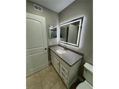 Beautifully Renovated FIRST FLOOR, CORNER UNIT with private on Fountain Lakes Community Golf Course in Florida - for sale on GolfHomes.com, golf home, golf lot