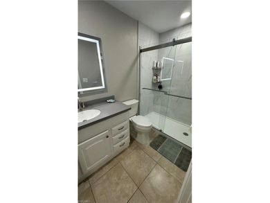 Beautifully Renovated FIRST FLOOR, CORNER UNIT with private on Fountain Lakes Community Golf Course in Florida - for sale on GolfHomes.com, golf home, golf lot