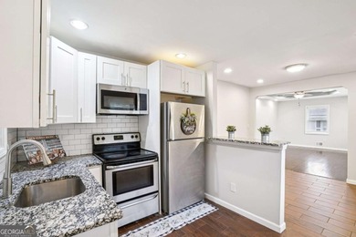 Charming brick ranch on a basement, perfectly positioned in a on Browns Mill Golf Course in Georgia - for sale on GolfHomes.com, golf home, golf lot