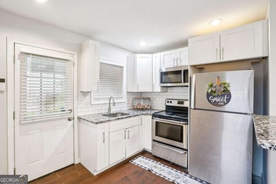 Charming brick ranch on a basement, perfectly positioned in a on Browns Mill Golf Course in Georgia - for sale on GolfHomes.com, golf home, golf lot