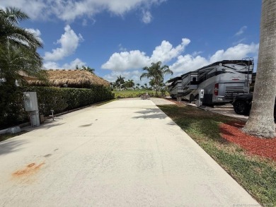 This prime pull-in lot offers breathtaking golf course and water on Motorcoach Resort Golf Course in Florida - for sale on GolfHomes.com, golf home, golf lot