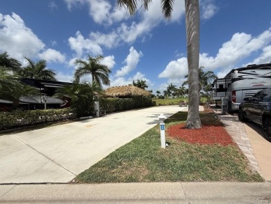 This prime pull-in lot offers breathtaking golf course and water on Motorcoach Resort Golf Course in Florida - for sale on GolfHomes.com, golf home, golf lot