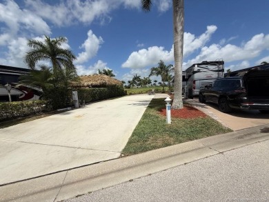 This prime pull-in lot offers breathtaking golf course and water on Motorcoach Resort Golf Course in Florida - for sale on GolfHomes.com, golf home, golf lot