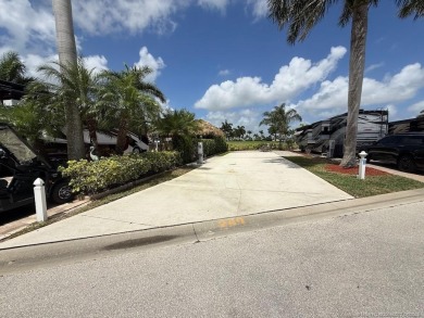 This prime pull-in lot offers breathtaking golf course and water on Motorcoach Resort Golf Course in Florida - for sale on GolfHomes.com, golf home, golf lot