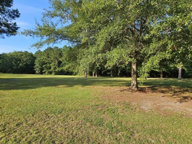 Beautiful .50-acre level building lot with a Boat Slip in Wyboo on Players Course At Wyboo Plantation in South Carolina - for sale on GolfHomes.com, golf home, golf lot