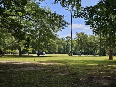 Beautiful .50-acre level building lot with a Boat Slip in Wyboo on Players Course At Wyboo Plantation in South Carolina - for sale on GolfHomes.com, golf home, golf lot