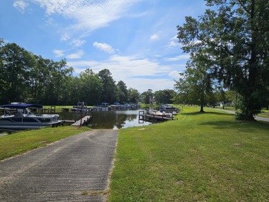 Beautiful .50-acre level building lot with a Boat Slip in Wyboo on Players Course At Wyboo Plantation in South Carolina - for sale on GolfHomes.com, golf home, golf lot