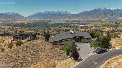 This jaw-dropping Mountain Masterpiece is ready to join the most on Red Ledges Golf Club in Utah - for sale on GolfHomes.com, golf home, golf lot