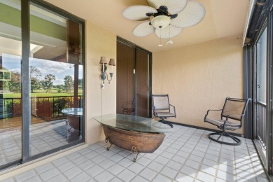This stunning first-floor 2-bd, 2-ba condo offers a lifestyle of on BallenIsles Golf and Country Club in Florida - for sale on GolfHomes.com, golf home, golf lot