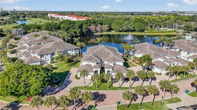 ELEVATE YOURSELF into this lovely second-floor coach home in on Pelican Marsh Golf Club in Florida - for sale on GolfHomes.com, golf home, golf lot