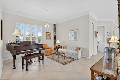 ELEVATE YOURSELF into this lovely second-floor coach home in on Pelican Marsh Golf Club in Florida - for sale on GolfHomes.com, golf home, golf lot