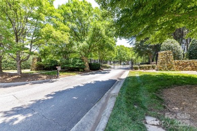 Beautiful, Waterview, level, wooded lot located in the gated on Trump National Golf Club Charlotte in North Carolina - for sale on GolfHomes.com, golf home, golf lot