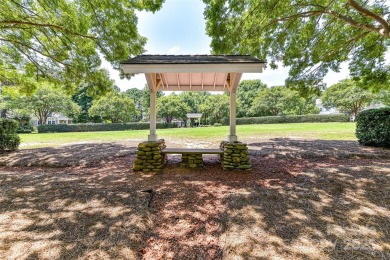 Beautiful, Waterview, level, wooded lot located in the gated on Trump National Golf Club Charlotte in North Carolina - for sale on GolfHomes.com, golf home, golf lot