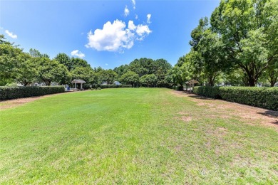 Beautiful, Waterview, level, wooded lot located in the gated on Trump National Golf Club Charlotte in North Carolina - for sale on GolfHomes.com, golf home, golf lot
