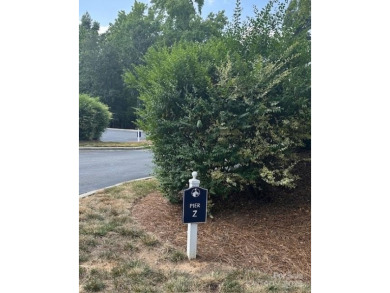 Beautiful, Waterview, level, wooded lot located in the gated on Trump National Golf Club Charlotte in North Carolina - for sale on GolfHomes.com, golf home, golf lot