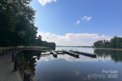 Beautiful, Waterview, level, wooded lot located in the gated on Trump National Golf Club Charlotte in North Carolina - for sale on GolfHomes.com, golf home, golf lot