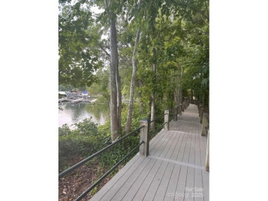 Beautiful, Waterview, level, wooded lot located in the gated on Trump National Golf Club Charlotte in North Carolina - for sale on GolfHomes.com, golf home, golf lot