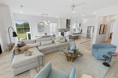 Overlooking the harbor, amphitheater and iconic Hennybay Bridge on Long Cove Golf Course in Texas - for sale on GolfHomes.com, golf home, golf lot