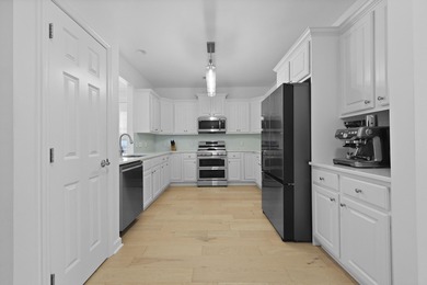 Welcome to 132 Fresh Meadow Lane - An Exceptional End-Unit on Dunes West Golf Club in South Carolina - for sale on GolfHomes.com, golf home, golf lot