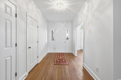 Courtyard entrance and elegance to this Pawleys Plantation on Pawleys Plantation Golf and Country Club in South Carolina - for sale on GolfHomes.com, golf home, golf lot