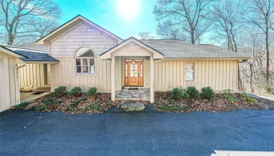 Discover your mountain retreat offering sweeping views of Lake on Lake Toxaway Country Club in North Carolina - for sale on GolfHomes.com, golf home, golf lot