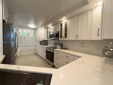 Beautifully remodeled 3 bedroom 2 bath first floor unit WITH on Sunrise Lakes Phase IV Golf Course in Florida - for sale on GolfHomes.com, golf home, golf lot