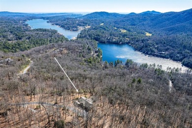 Discover your mountain retreat offering sweeping views of Lake on Lake Toxaway Country Club in North Carolina - for sale on GolfHomes.com, golf home, golf lot