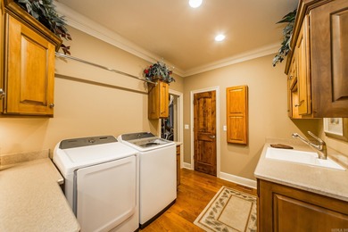 Experience the pinnacle of lakefront luxury in this furnished on  in Arkansas - for sale on GolfHomes.com, golf home, golf lot