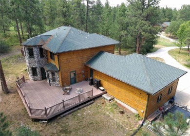 Nestled in the peaceful forest of Larkspur, CO, this mountain on The Golf Club At Bear Dance in Colorado - for sale on GolfHomes.com, golf home, golf lot