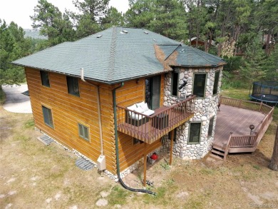 Nestled in the peaceful forest of Larkspur, CO, this mountain on The Golf Club At Bear Dance in Colorado - for sale on GolfHomes.com, golf home, golf lot