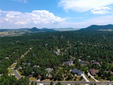 Nestled in the peaceful forest of Larkspur, CO, this mountain on The Golf Club At Bear Dance in Colorado - for sale on GolfHomes.com, golf home, golf lot