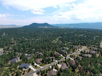 Nestled in the peaceful forest of Larkspur, CO, this mountain on The Golf Club At Bear Dance in Colorado - for sale on GolfHomes.com, golf home, golf lot