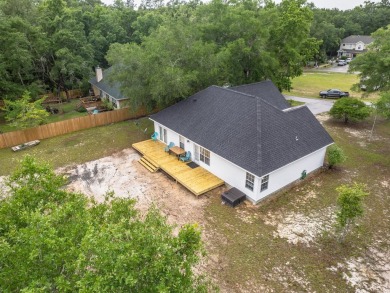 Welcome to this beautifully maintained 3-bedroom, 2-bathroom on Wildwood Country Club in Florida - for sale on GolfHomes.com, golf home, golf lot