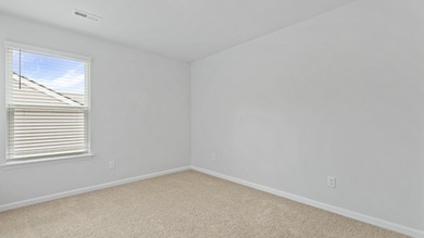 This two-story plan boasts a luxurious primary bedroom upstairs on Shannon Greens Golf Course in South Carolina - for sale on GolfHomes.com, golf home, golf lot