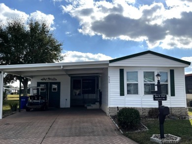 Updates make this 2 bedroom 2 bath, 1989 home sitting on a golf on Lake Henry Golf Club in Florida - for sale on GolfHomes.com, golf home, golf lot