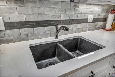 More than a townhome!... A smart, low-maintenance lifestyle near on Lake Shawnee Golf Course in Kansas - for sale on GolfHomes.com, golf home, golf lot