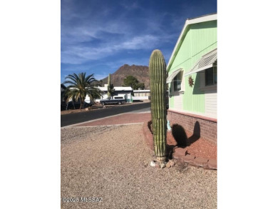 Newer 1996 3 bedroom 2 bath Cavco home on a quiet street with on Tucson Estates Golf Course in Arizona - for sale on GolfHomes.com, golf home, golf lot