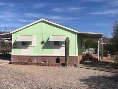 Newer 1996 3 bedroom 2 bath Cavco home on a quiet street with on Tucson Estates Golf Course in Arizona - for sale on GolfHomes.com, golf home, golf lot