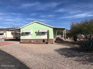 Newer 1996 3 bedroom 2 bath Cavco home on a quiet street with on Tucson Estates Golf Course in Arizona - for sale on GolfHomes.com, golf home, golf lot