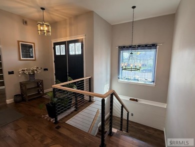 Spiral piers are the focal point of the double door grand entry on Teton Lakes Golf Courses in Idaho - for sale on GolfHomes.com, golf home, golf lot