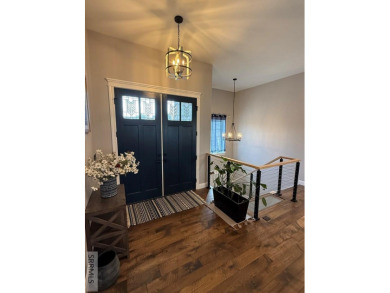Spiral piers are the focal point of the double door grand entry on Teton Lakes Golf Courses in Idaho - for sale on GolfHomes.com, golf home, golf lot