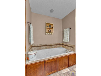 More than a townhome!... A smart, low-maintenance lifestyle near on Lake Shawnee Golf Course in Kansas - for sale on GolfHomes.com, golf home, golf lot