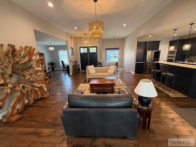 Spiral piers are the focal point of the double door grand entry on Teton Lakes Golf Courses in Idaho - for sale on GolfHomes.com, golf home, golf lot