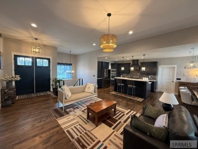 Spiral piers are the focal point of the double door grand entry on Teton Lakes Golf Courses in Idaho - for sale on GolfHomes.com, golf home, golf lot