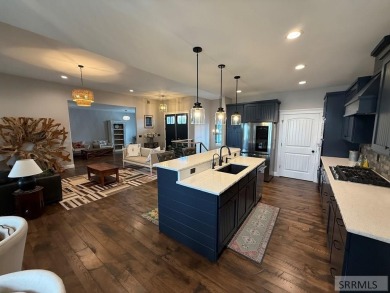 Spiral piers are the focal point of the double door grand entry on Teton Lakes Golf Courses in Idaho - for sale on GolfHomes.com, golf home, golf lot