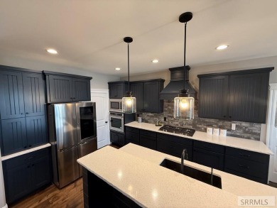 Spiral piers are the focal point of the double door grand entry on Teton Lakes Golf Courses in Idaho - for sale on GolfHomes.com, golf home, golf lot