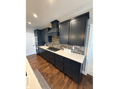 Spiral piers are the focal point of the double door grand entry on Teton Lakes Golf Courses in Idaho - for sale on GolfHomes.com, golf home, golf lot